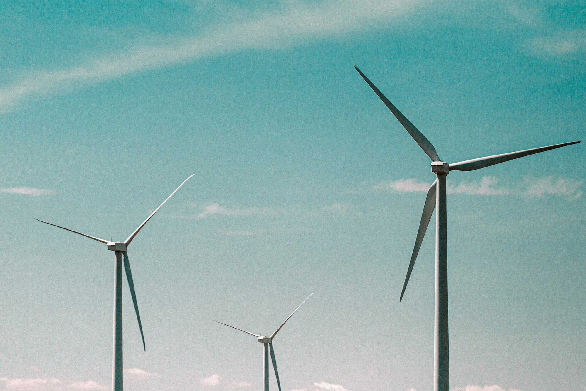 Wind turbines across an open renewable energy landscape